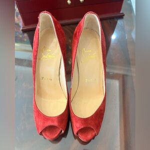 Red suede Christian Louboutins
